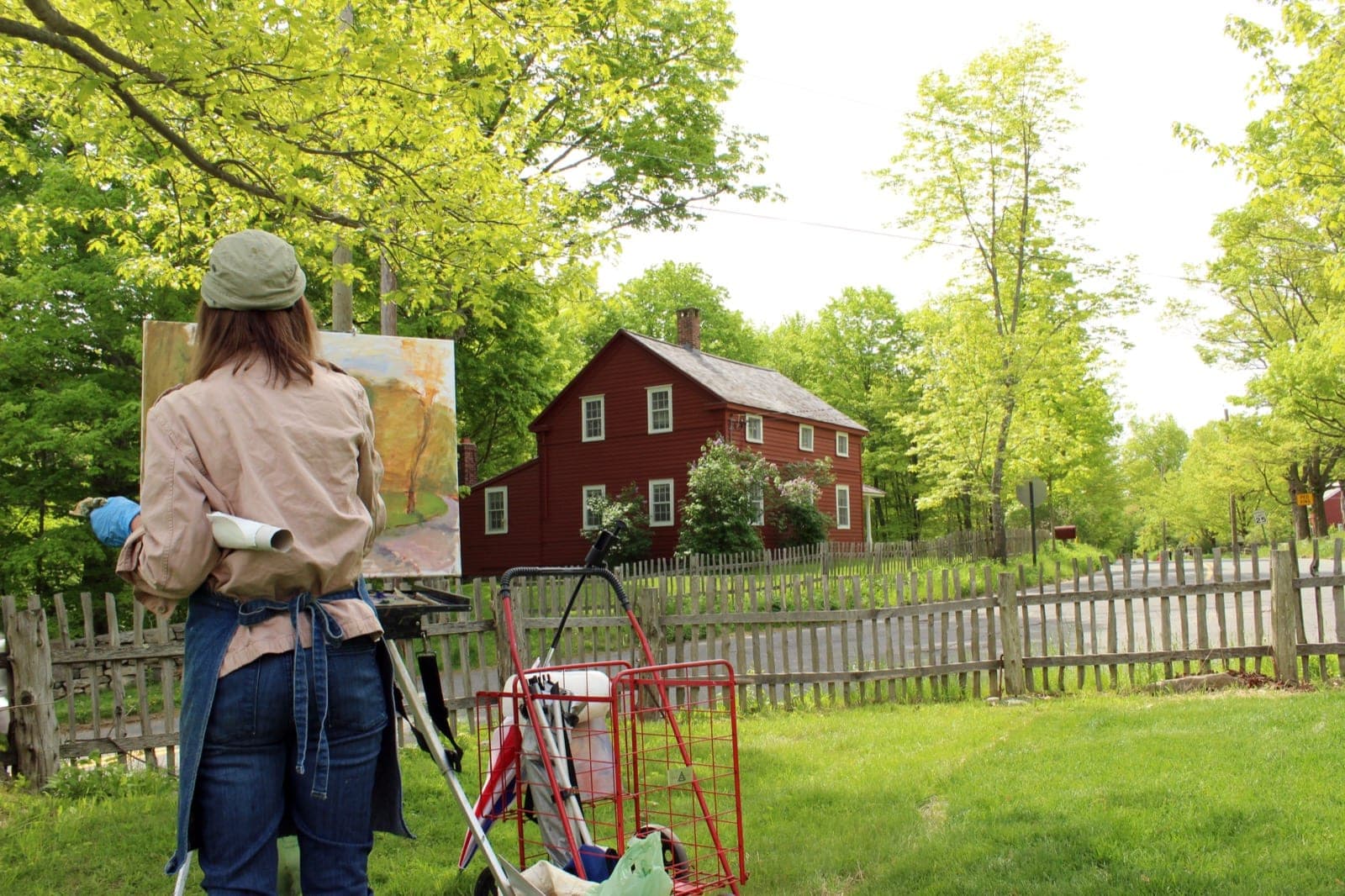 Artist painting en plein air at an easel outdoors — the kind of experience Austin drawing and painting classes offer