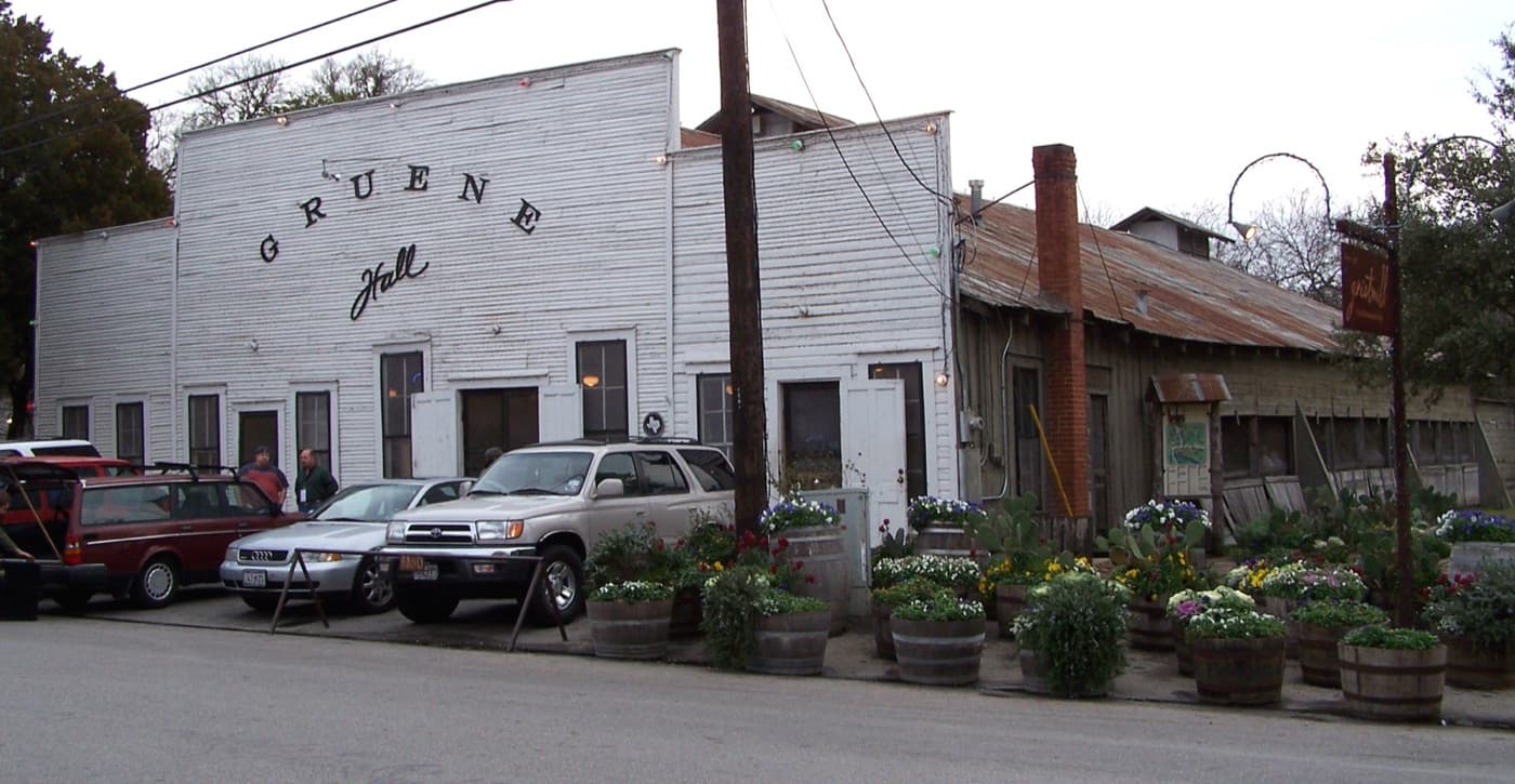 The weathered white front of Gruene Hall, Texas's oldest continually operating dance hall