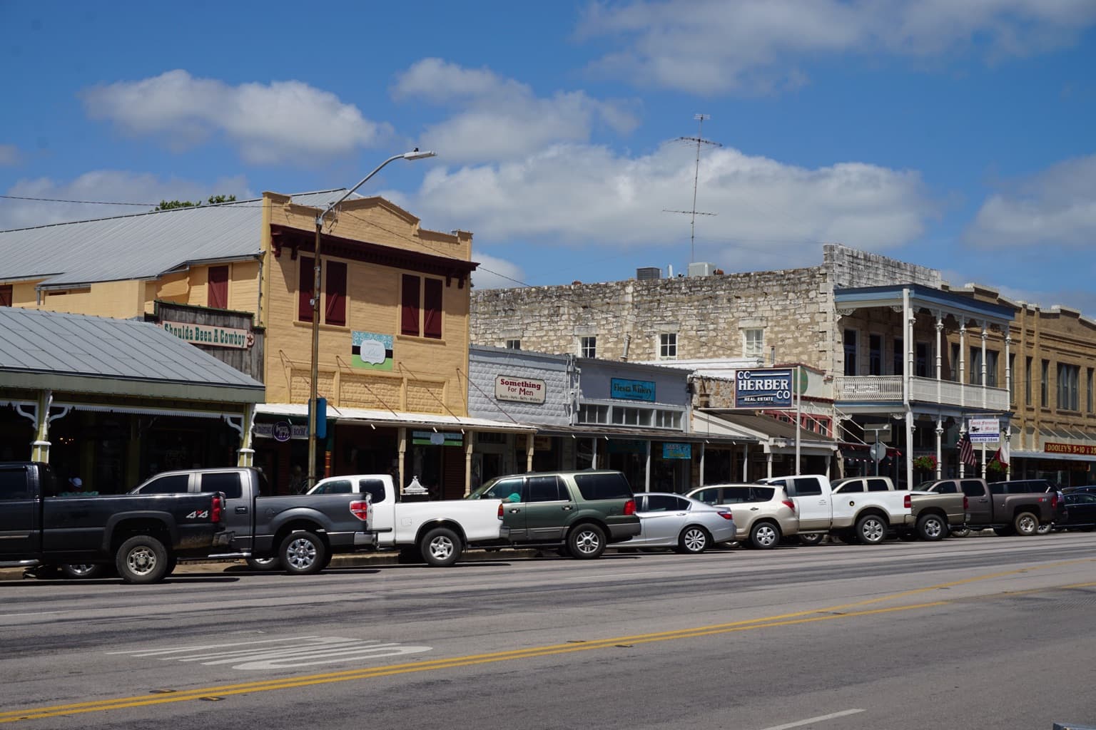 Shoppers passing the historic storefronts along East Main Street in Fredericksburg