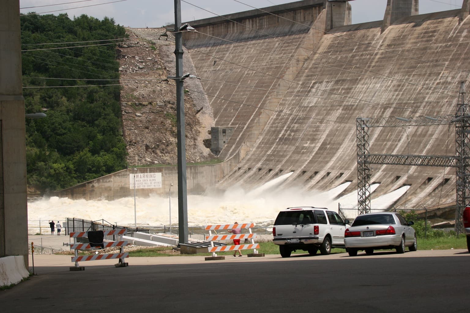 Water churning below Mansfield Dam with floodgates open as Lake Travis is drawn down after 2007 floods