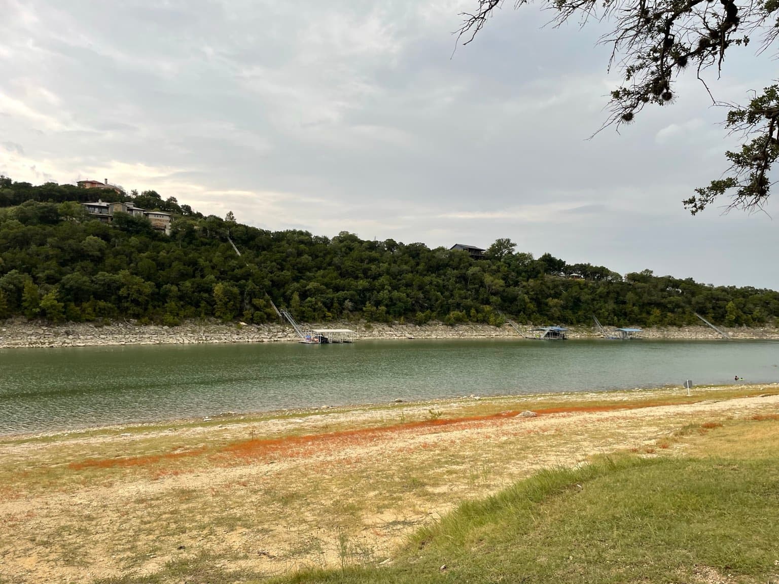 Calm water on the Sandy Creek arm of Lake Travis, seen from Jones Brothers Park in Jonestown