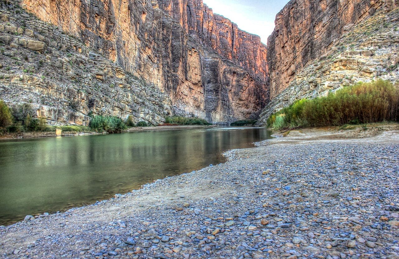 The Rio Grande flowing out of Santa Elena Canyon between sheer limestone walls in Big Bend National Park