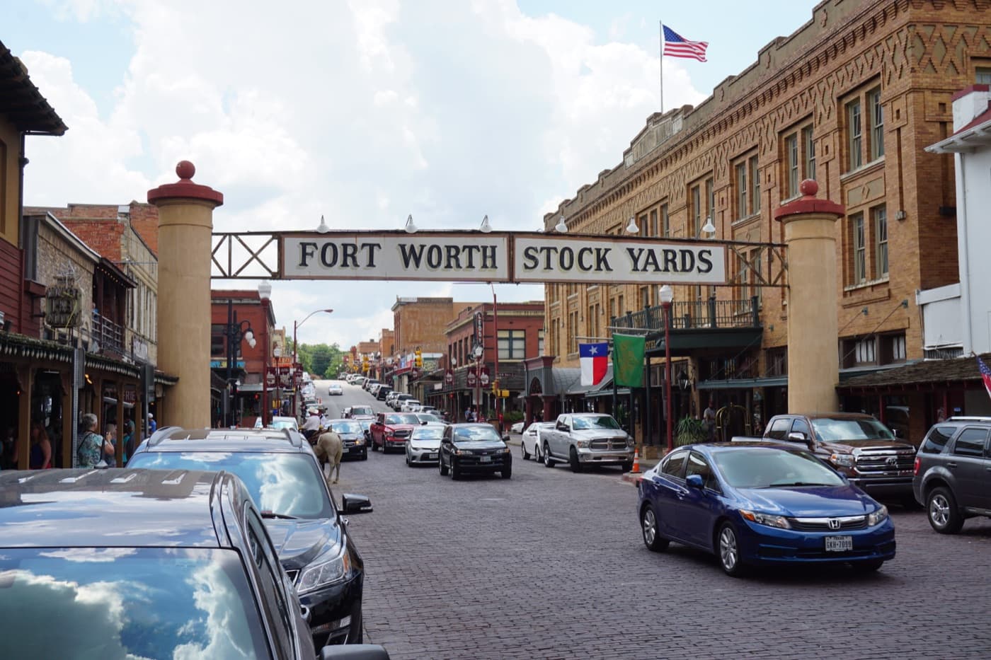 Brick-paved Exchange Avenue lined with western storefronts in the Fort Worth Stockyards