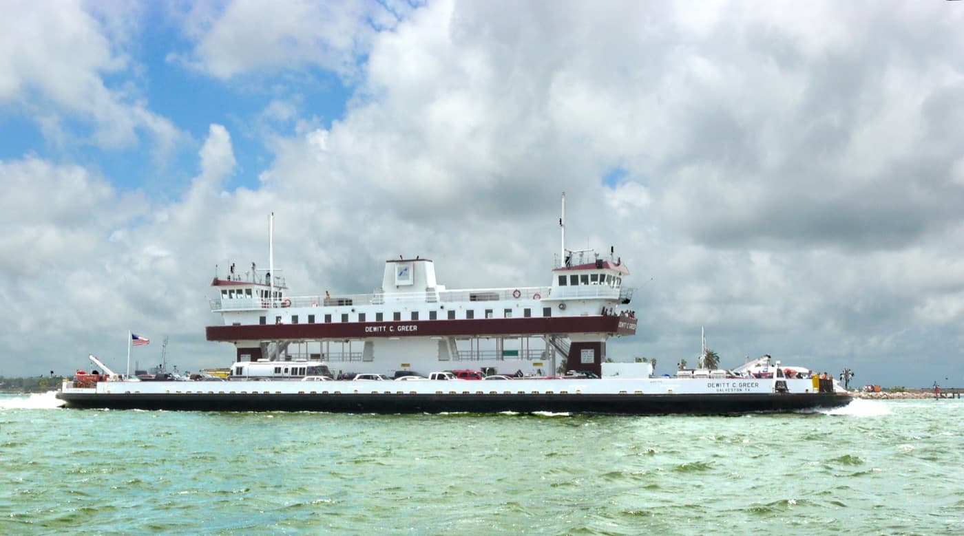 The free Galveston to Port Bolivar ferry carrying vehicles across the ship channel toward the Bolivar Peninsula