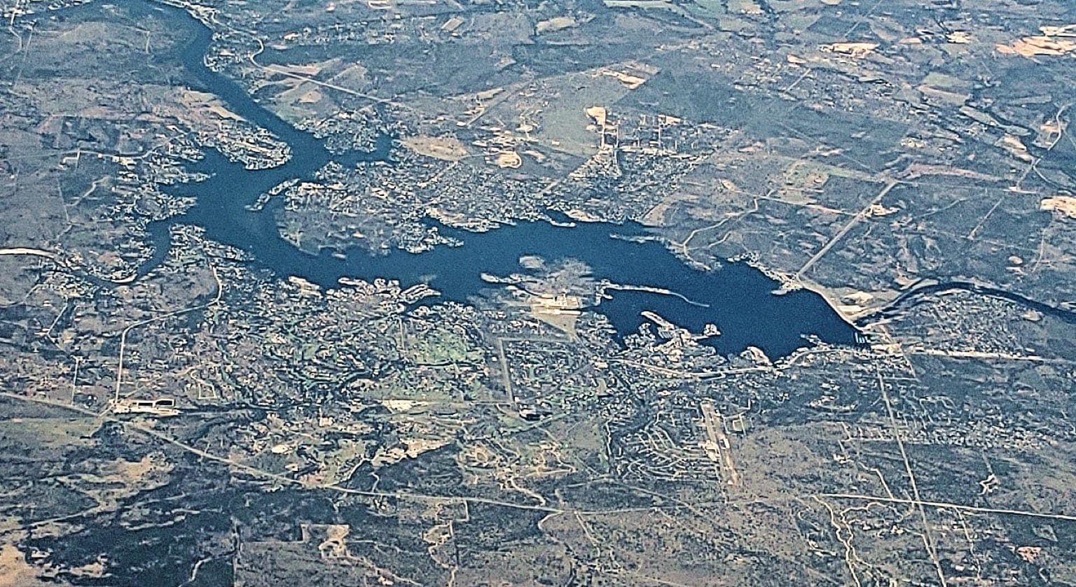 Aerial view of Lake LBJ with Horseshoe Bay on the near shore and Granite Shoals across the water