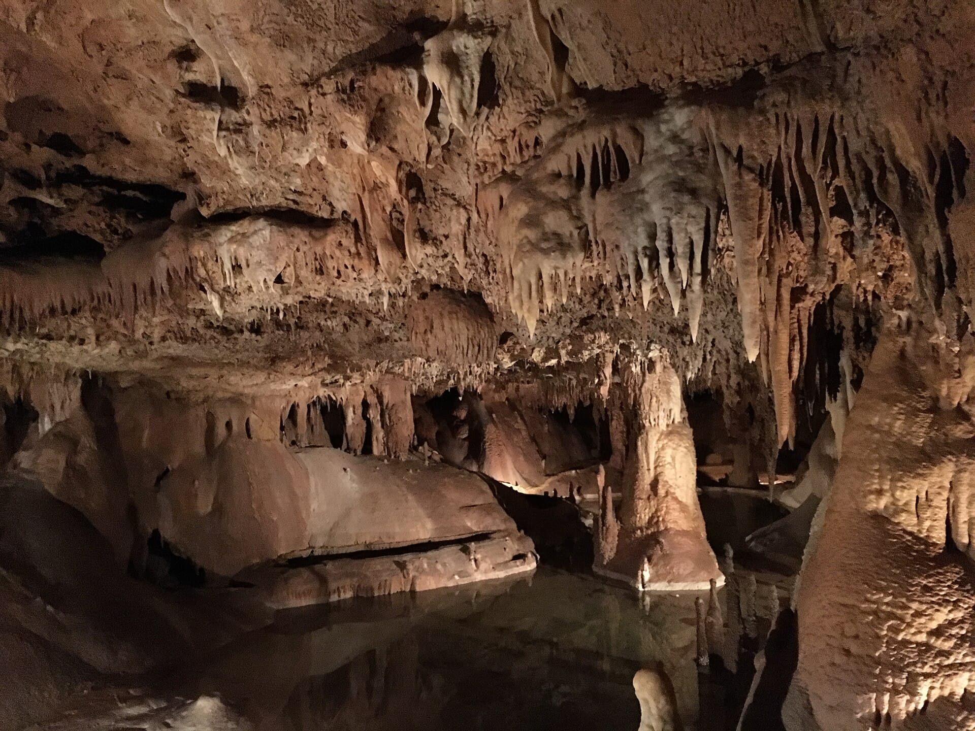 Inner Space Cavern in Georgetown, Texas — illuminated limestone formations and the cave walkway