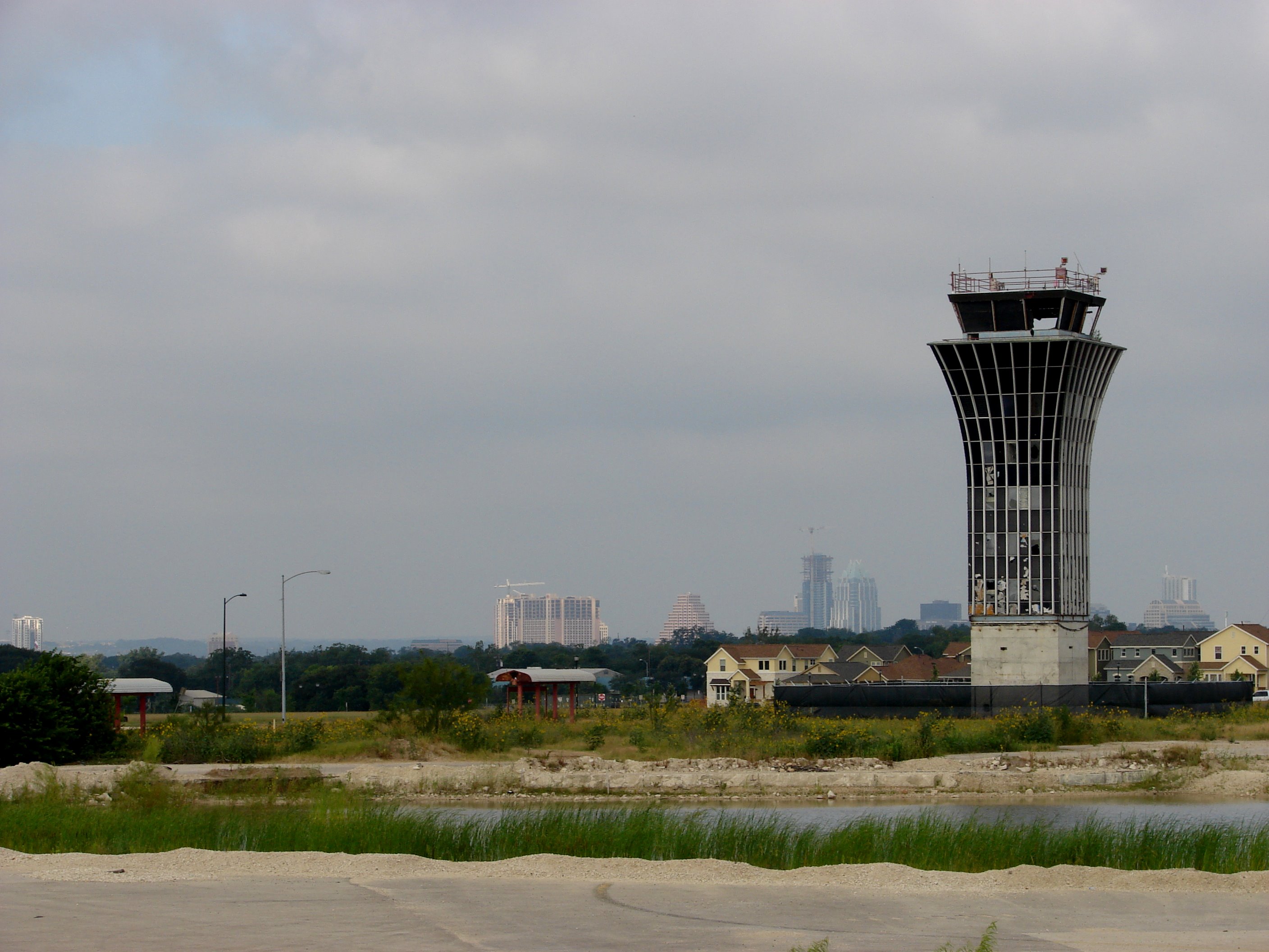 The Robert Mueller Municipal Airport control tower still standing over the Austin skyline, now part of the Mueller redevelopment and Austin Studios film production facility