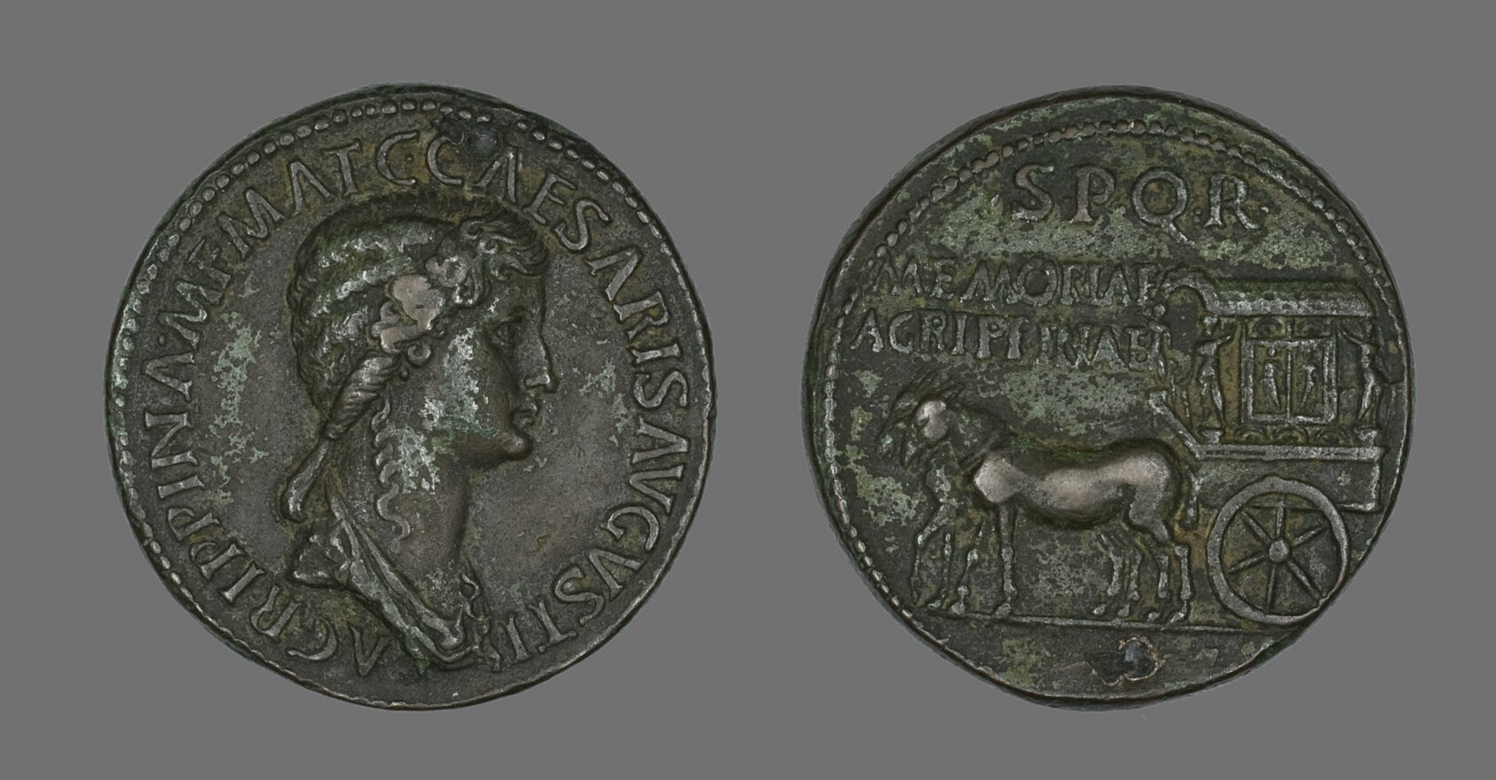 Both faces of an ancient Roman bronze sestertius coin, a portrait of Agrippina on one side and a mule-drawn carriage on the other