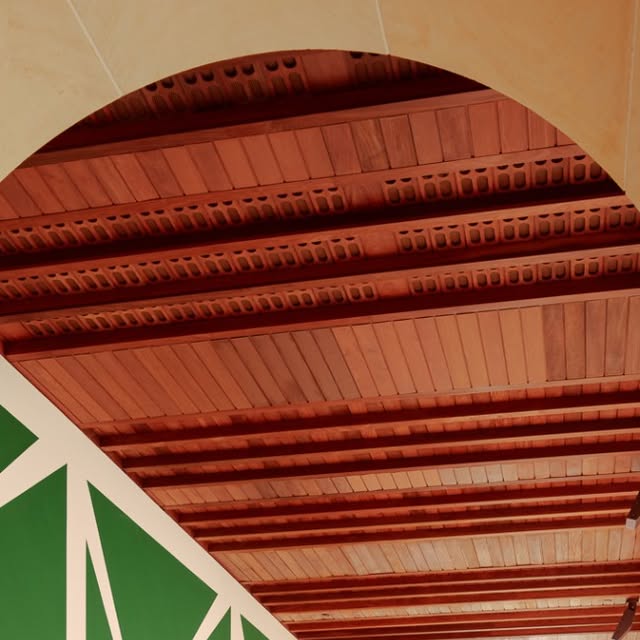 The Blanton Museum's arched architecture framing a bold green geometric artwork from their collection