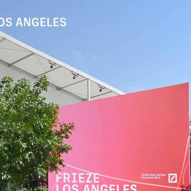 The pink Frieze Los Angeles tent and signage against a blue California sky