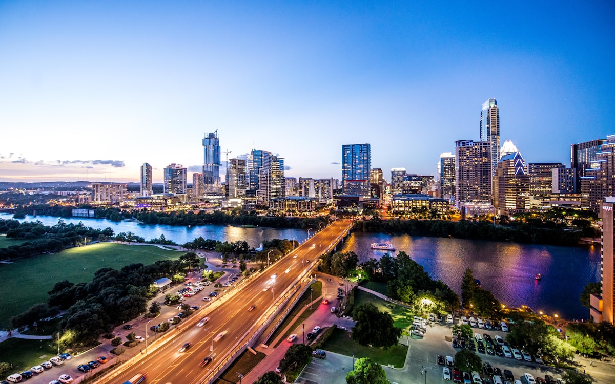 The Austin skyline from Lady Bird Lake — the waterfront that Oracle chose for its headquarters in 2020, four years before partially moving to Nashville