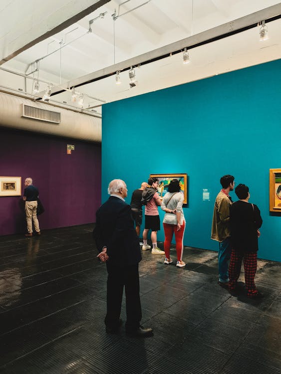 Visitors touring an open artist studio during a studio tour event
