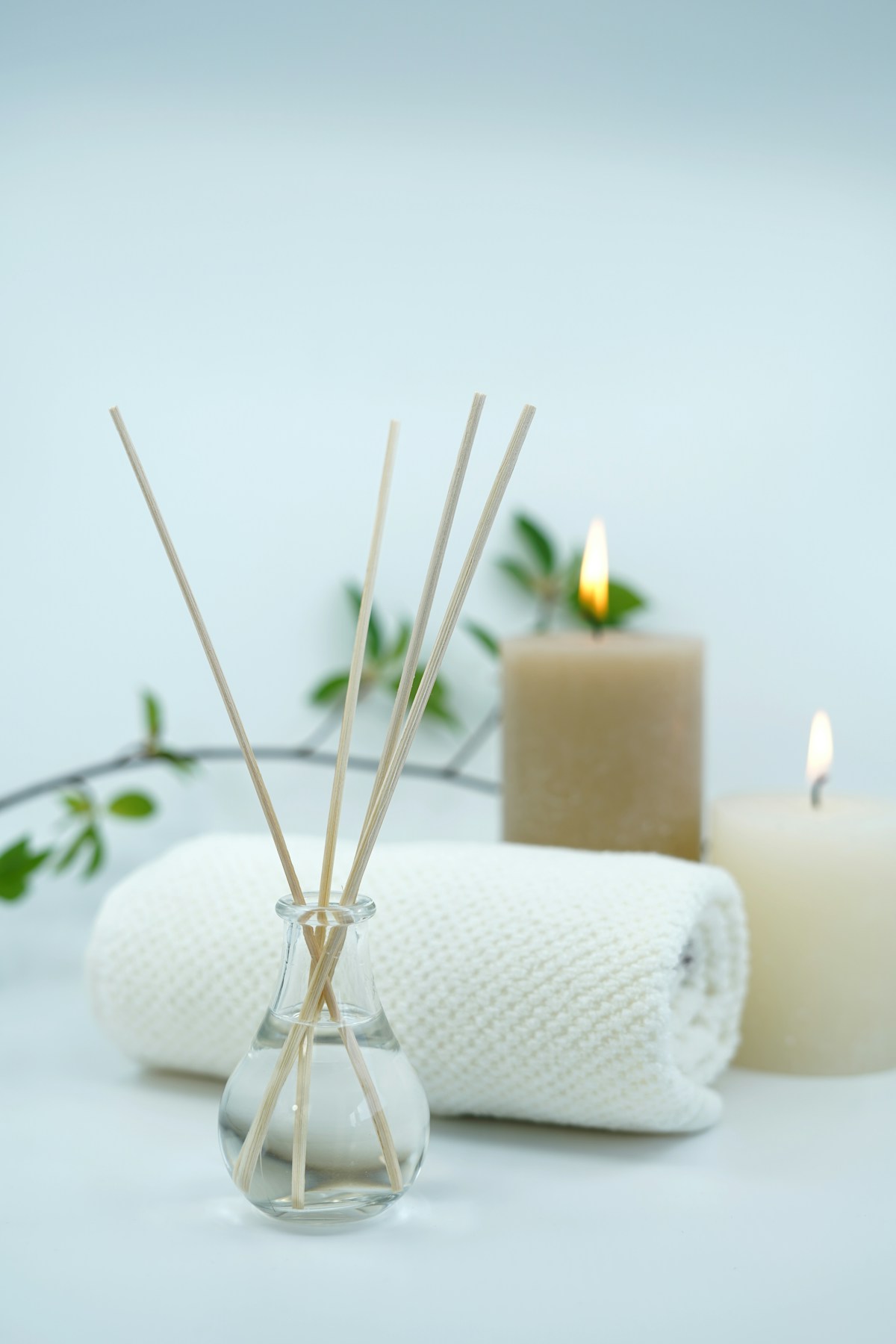 Spa treatment setup with candles, towels, and aromatherapy