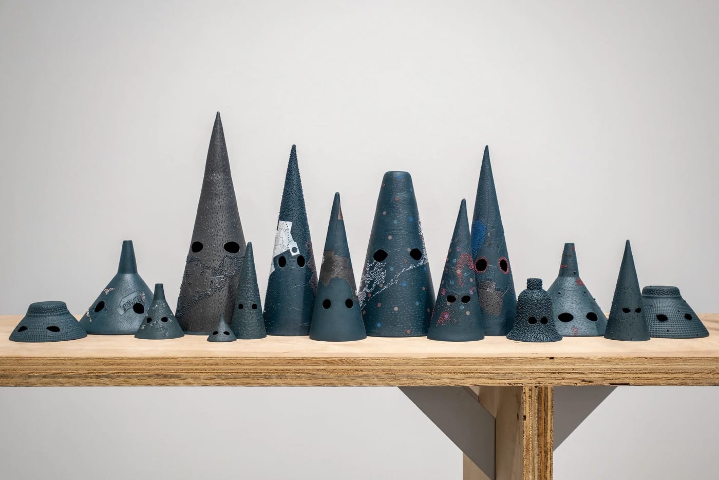 A pigmented-porcelain sculpture by Tammie Rubin from her Always & Forever series of repeated cone forms