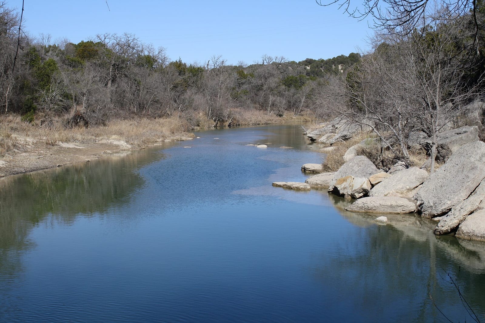 Dinosaur tracks pressed into the limestone bed of the Paluxy River at Dinosaur Valley State Park