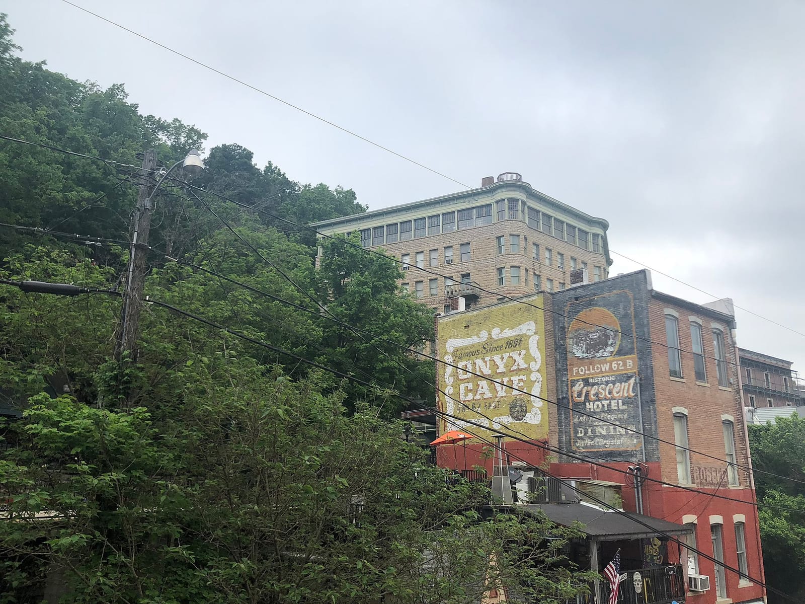 Steep Victorian street with gingerbread-trimmed houses in downtown Eureka Springs