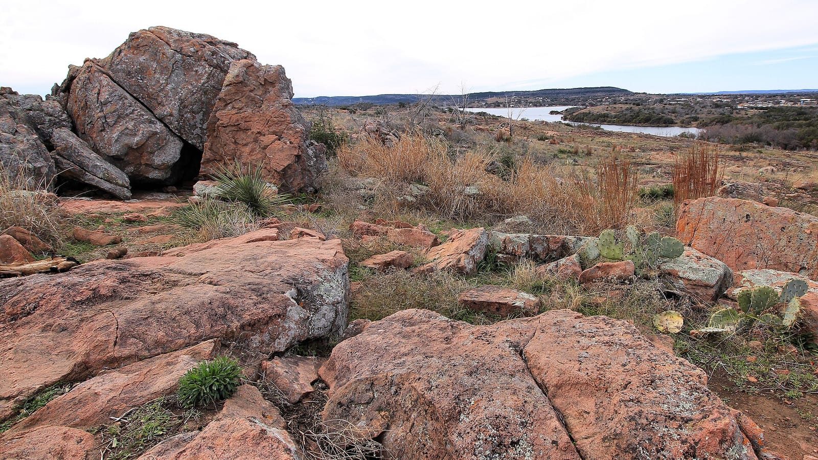 Pink granite shoreline at the Devil's Waterhole on Inks Lake