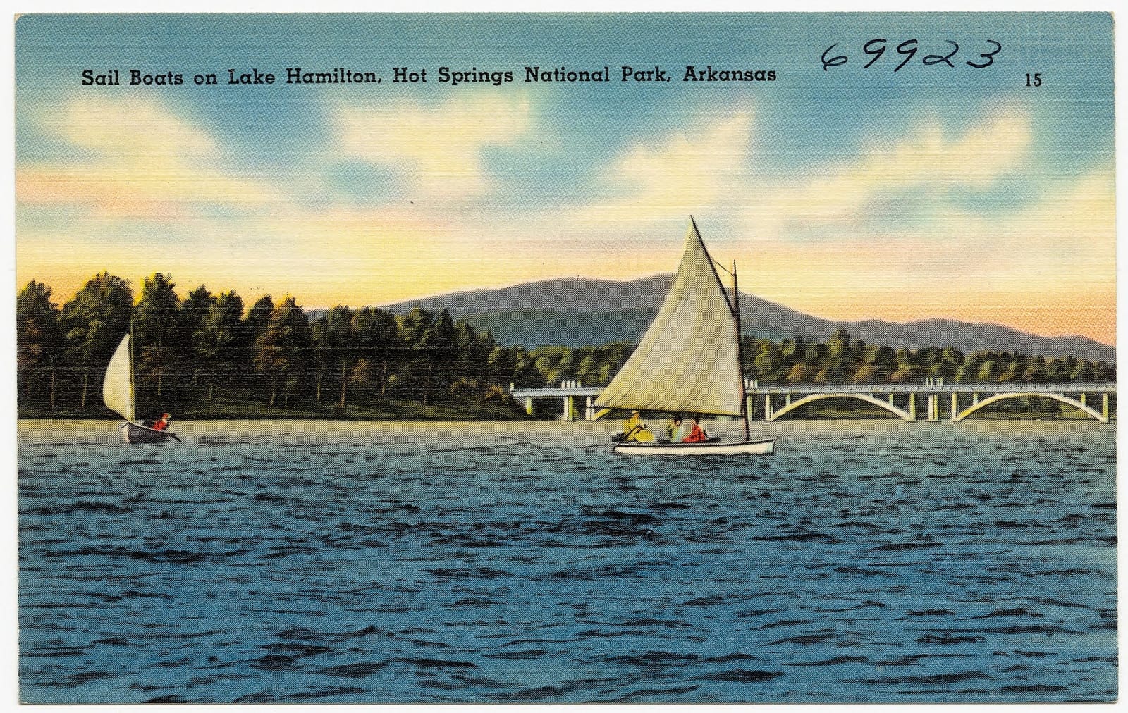 Dock-front houses and boats along the wooded shoreline of Lake Hamilton