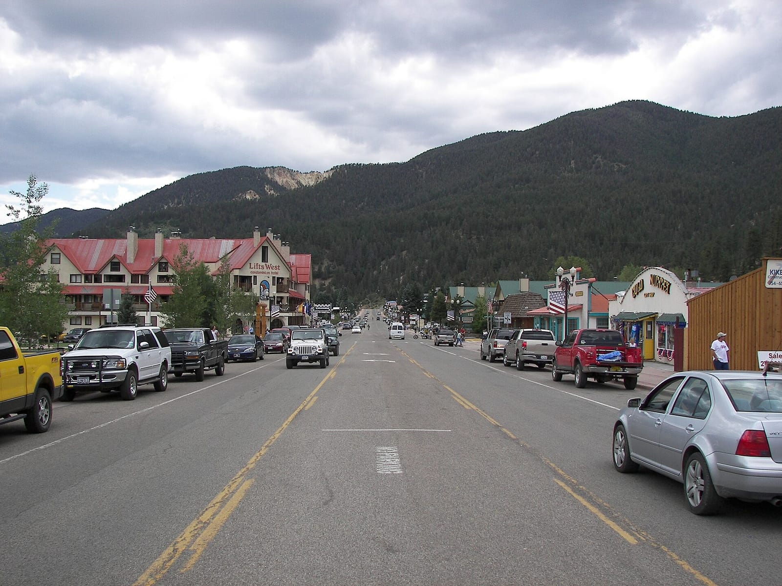 Main street storefronts beneath the ski slopes rising directly above Red River, New Mexico