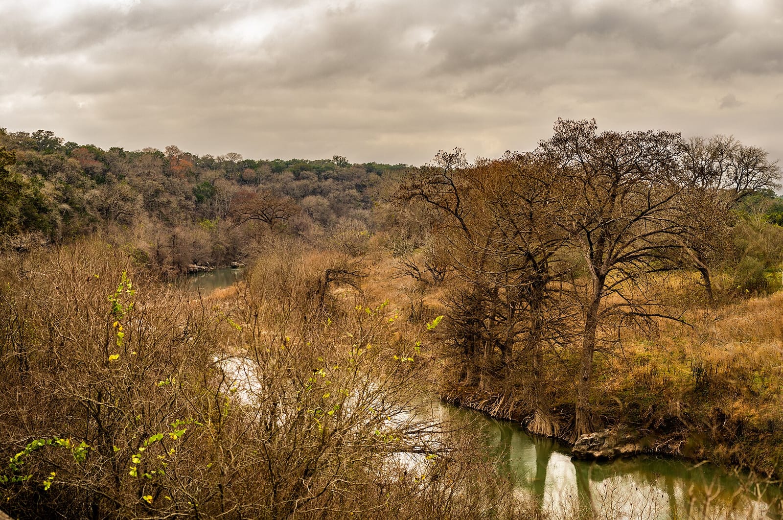 A quiet upper bend of the Guadalupe River below Canyon Dam near Sattler